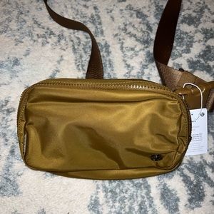 Brand new with tags. Wear everywhere belt bag. Burnt caramel . Never used.